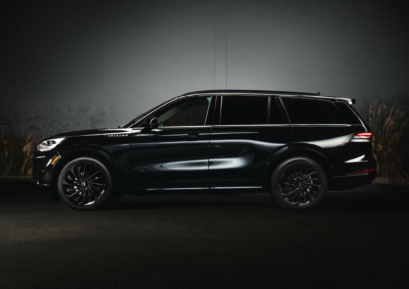 A 2024 Lincoln Aviator® SUV is shown in the Infinite Black exterior color | Johnson Sewell Lincoln in Marble Falls TX