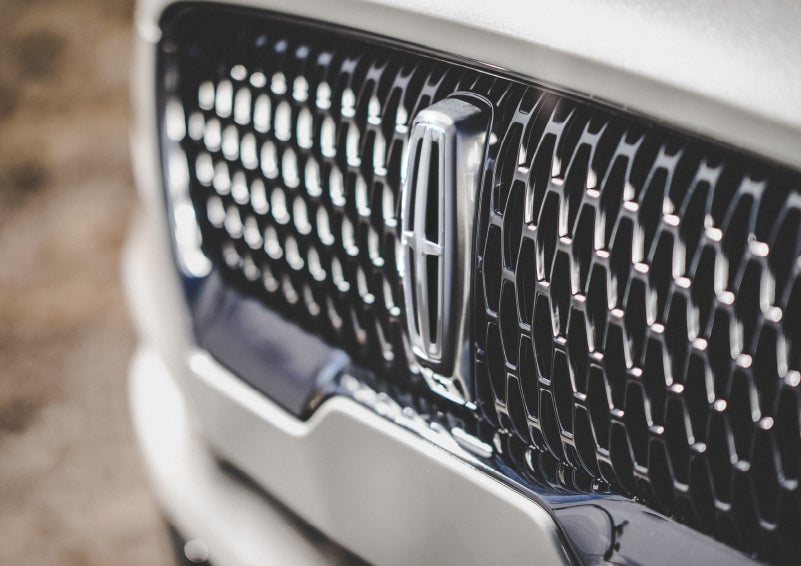 The grille of the 2024 Lincoln Aviator® Reserve model with an eye-catching repeated field of Lincoln Star logo shapes | Johnson Sewell Lincoln in Marble Falls TX