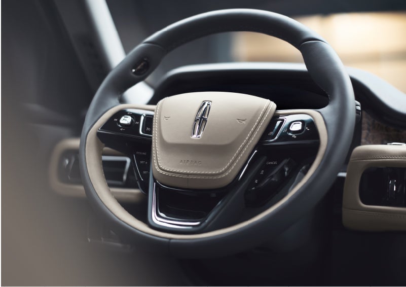 The intuitively placed controls of the steering wheel on a 2023 Lincoln Aviator® SUV | Johnson Sewell Lincoln in Marble Falls TX