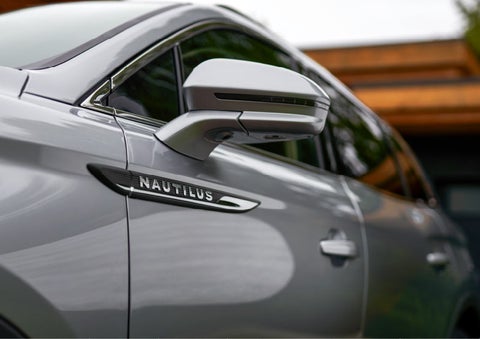 The sleek badge of a 2023 Lincoln Nautilus® SUV shows sleek design.