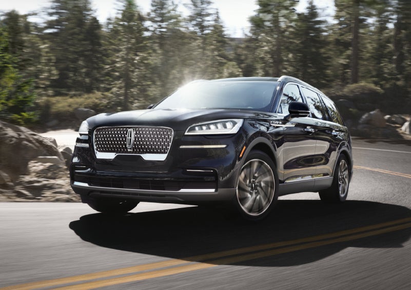 A Lincoln Aviator® SUV is being driven on a winding mountain road | Johnson Sewell Lincoln in Marble Falls TX