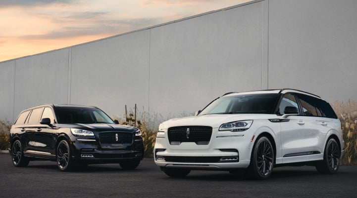 Two Lincoln Aviator® SUVs are shown with the available Jet Appearance Package | Johnson Sewell Lincoln in Marble Falls TX